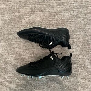 Jordan XII low cleats in all black. Promo model